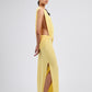 Yellow strapless dress on a light gray background