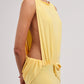 Yellow strapless dress on a light gray background