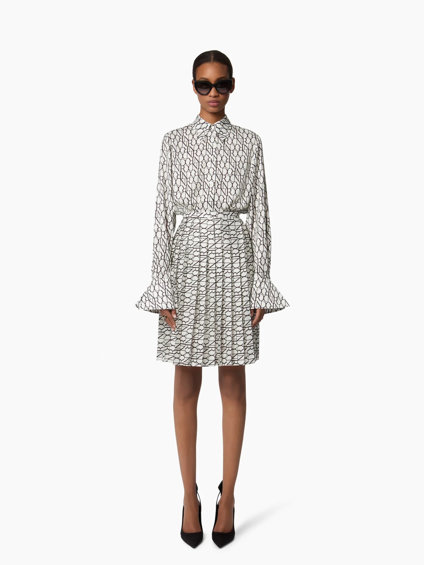 ALL OVER NR LOGO PLEATED MINI SKIRT
