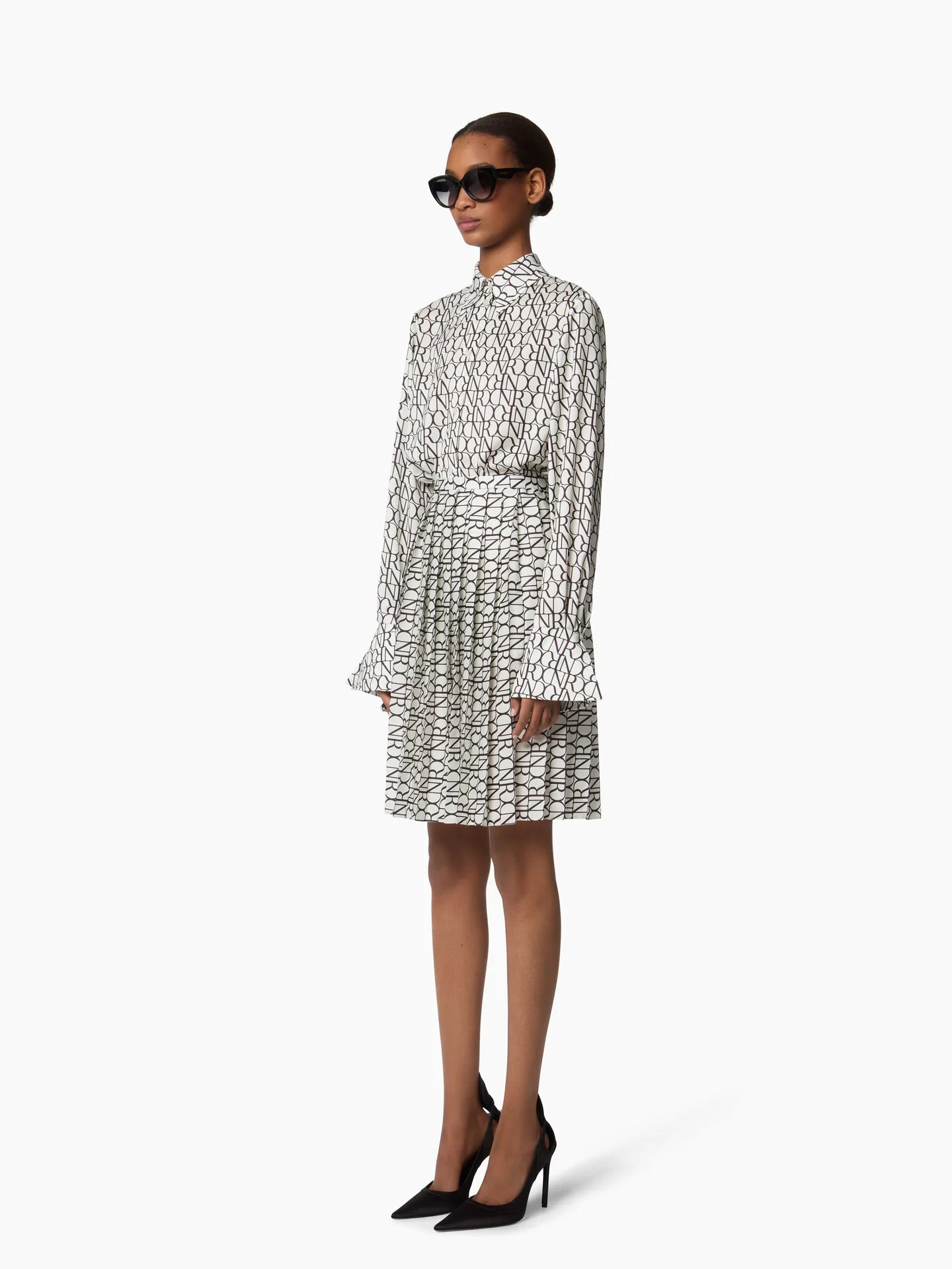 ALL OVER NR LOGO PLEATED MINI SKIRT
