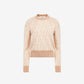 Beige and brown patterned sweater on a white background