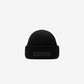 Black beanie hat on a white background