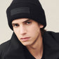 Black beanie hat on a white background