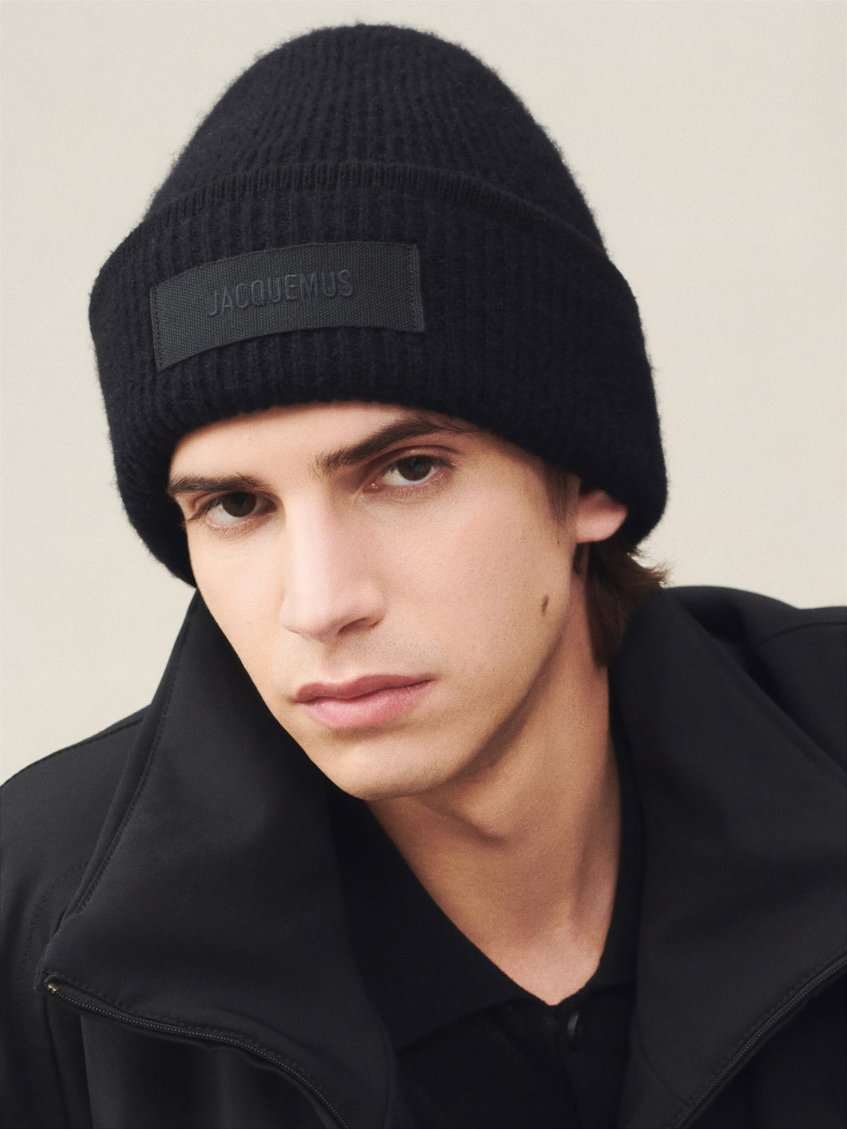 Black beanie hat on a white background