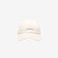 Beige cap with 'JACQUEMUS' branding on a white background