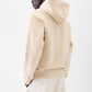 Beige hoodie with a brand logo on a white background