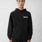 Black hoodie with a small logo on the chest against a white background