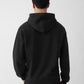 Black hoodie with a small logo on the chest against a white background
