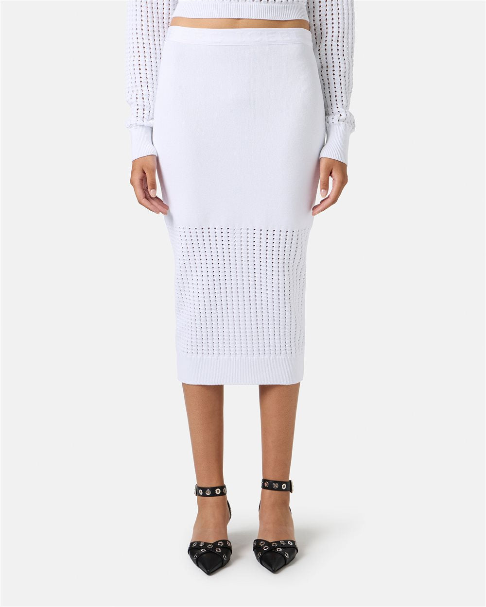 White knit pencil skirt worn by a person on a white background
