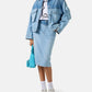Person wearing a denim outfit with a white background