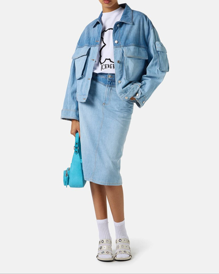 Person wearing a denim outfit with a white background