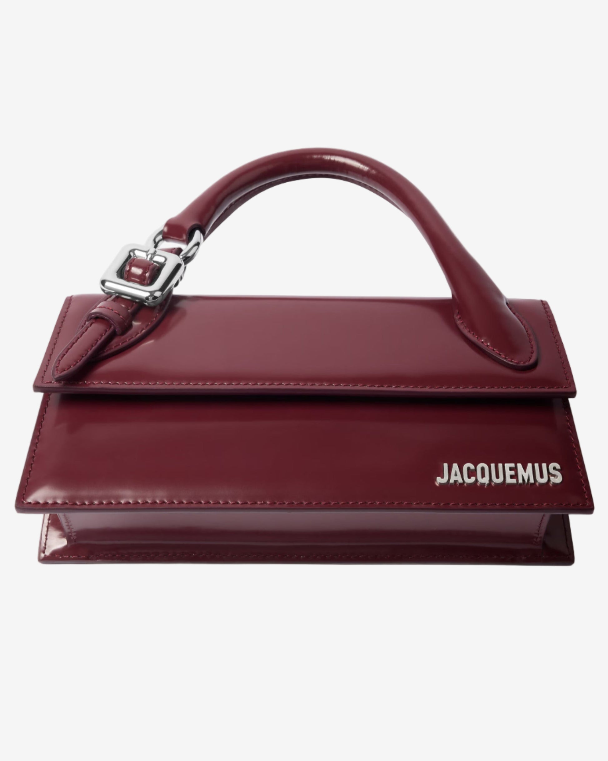Red handbag with a visible brand logo on a light gray background