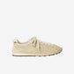 Beige sneaker on a white background
