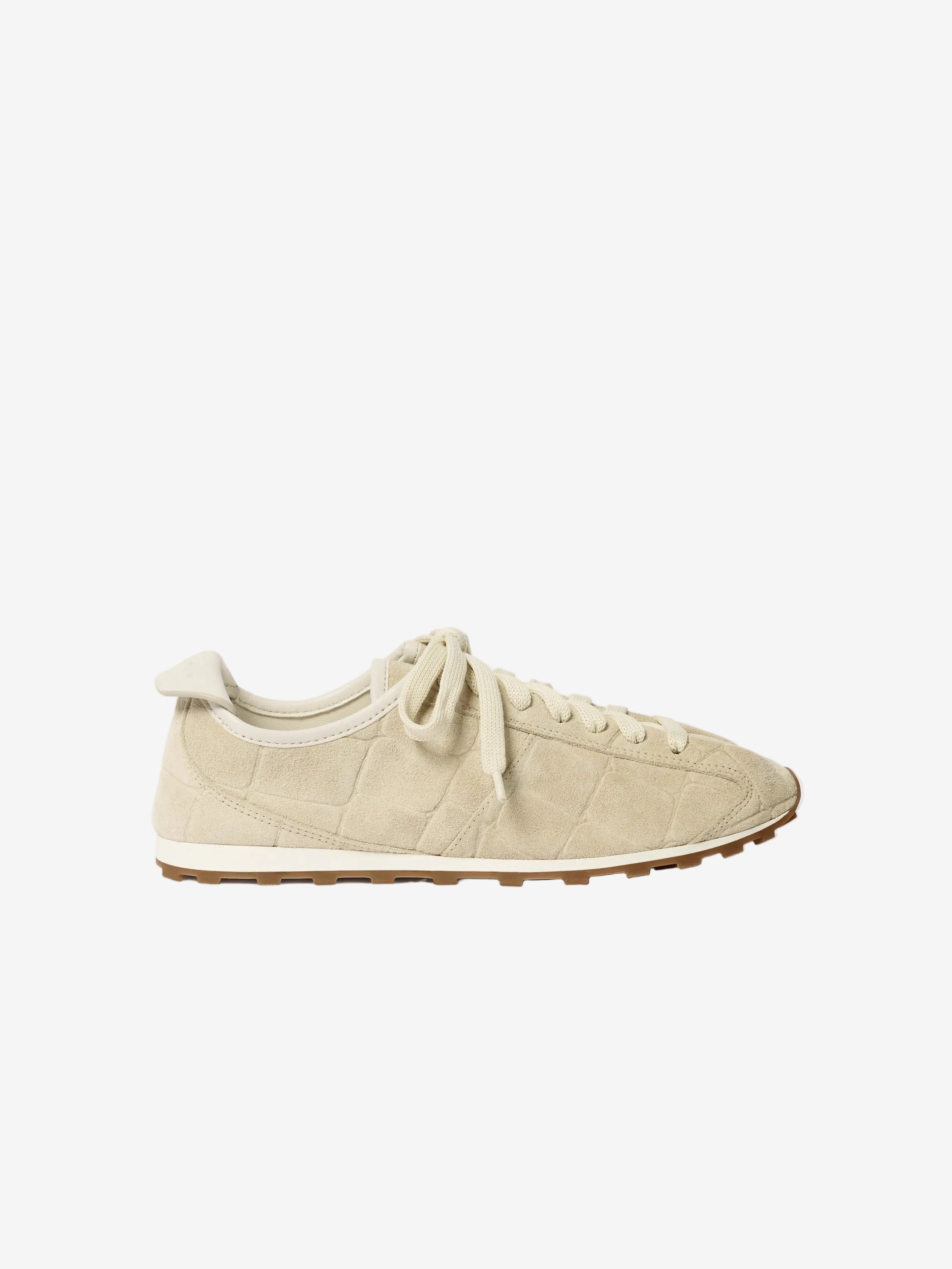 Beige sneaker on a white background
