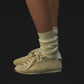 Beige sneaker on a white background