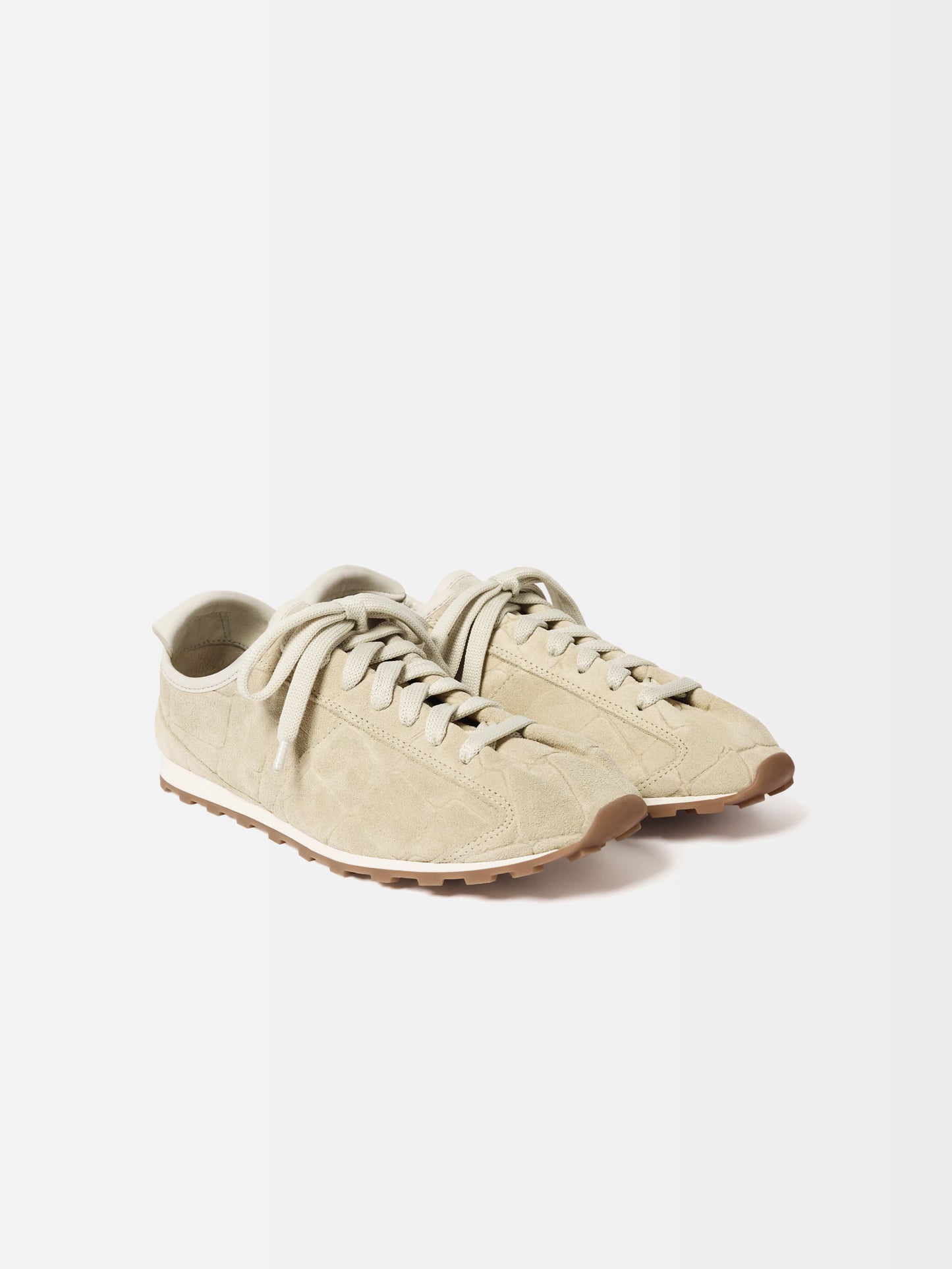 Beige sneaker on a white background
