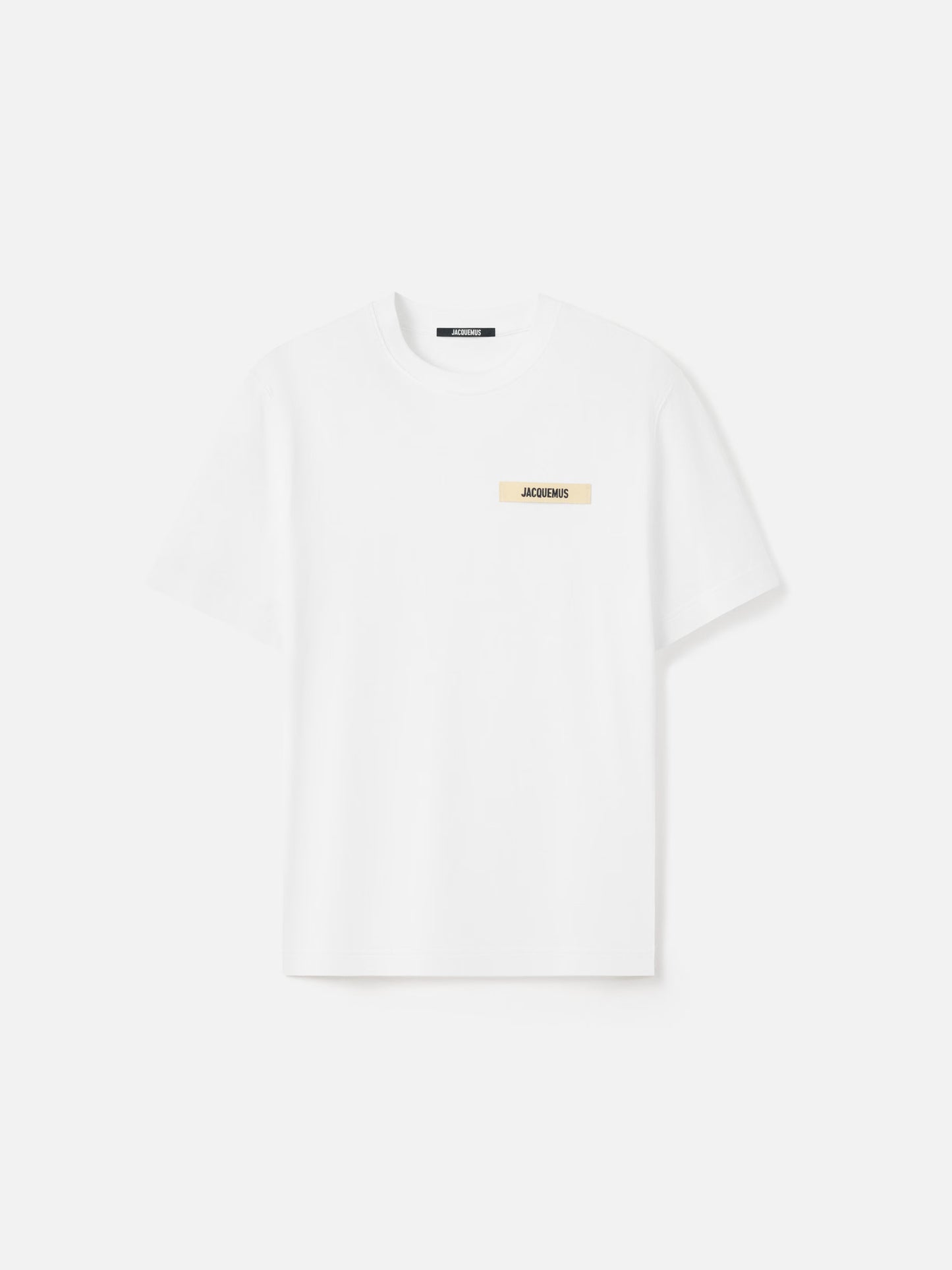 White t-shirt with a small logo on a white background