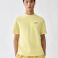 yellow t-shirt with a small logo on a white background
