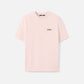 Light pink t-shirt with a small logo on a white background