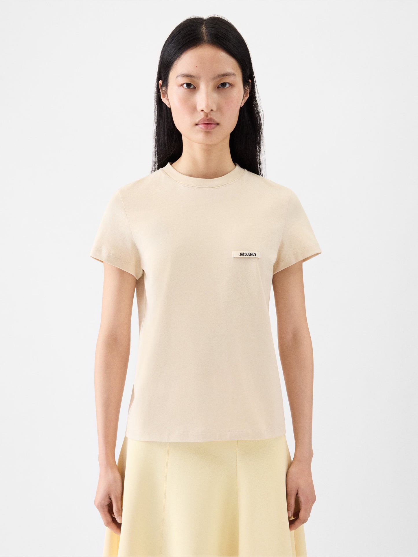 beige t-shirt with a small logo on a white background JACQUEMUS