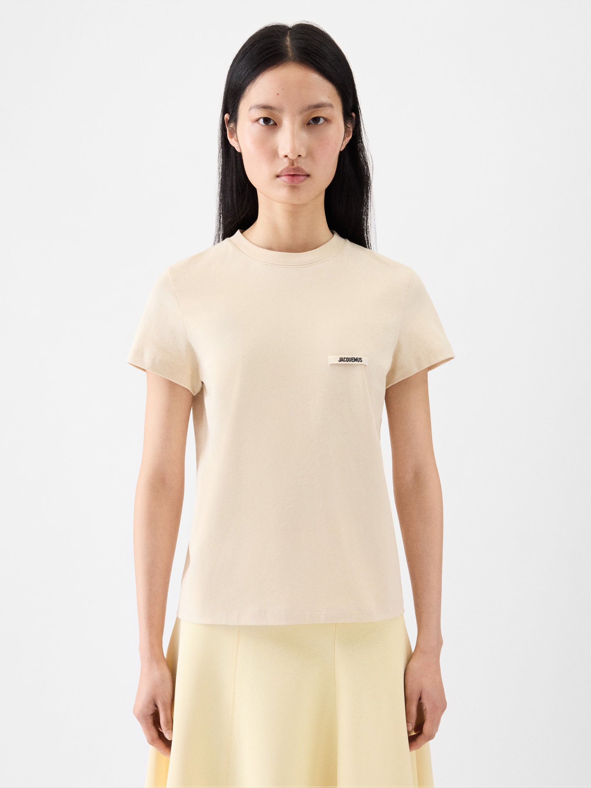 beige t-shirt with a small logo on a white background JACQUEMUS