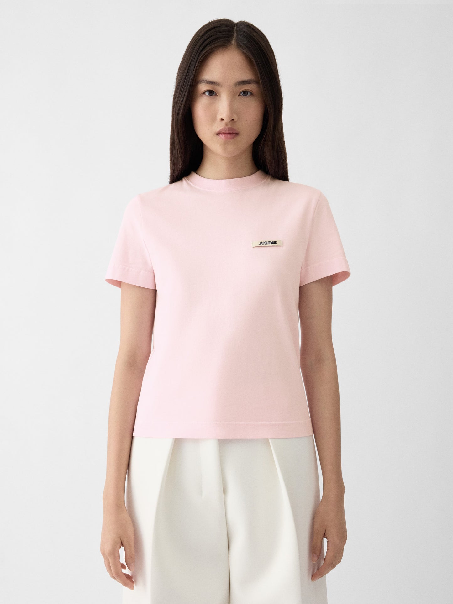 Pink t-shirt with a small logo on a white background JACQUEMUS