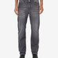 Person wearing gray jeans on a white background