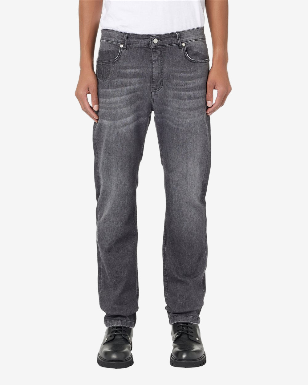 Person wearing gray jeans on a white background