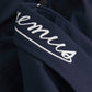 Navy blue shirt with a small graphic on the chest against a white background