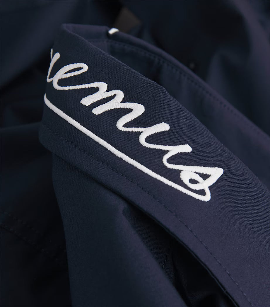 Navy blue shirt with a small graphic on the chest against a white background