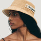 Beige bucket hat with 'Jacquemus' label on a white background