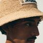 Beige bucket hat with 'Jacquemus' label on a white background
