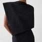 Black one-shoulder dress on a white background JACQUEMUS