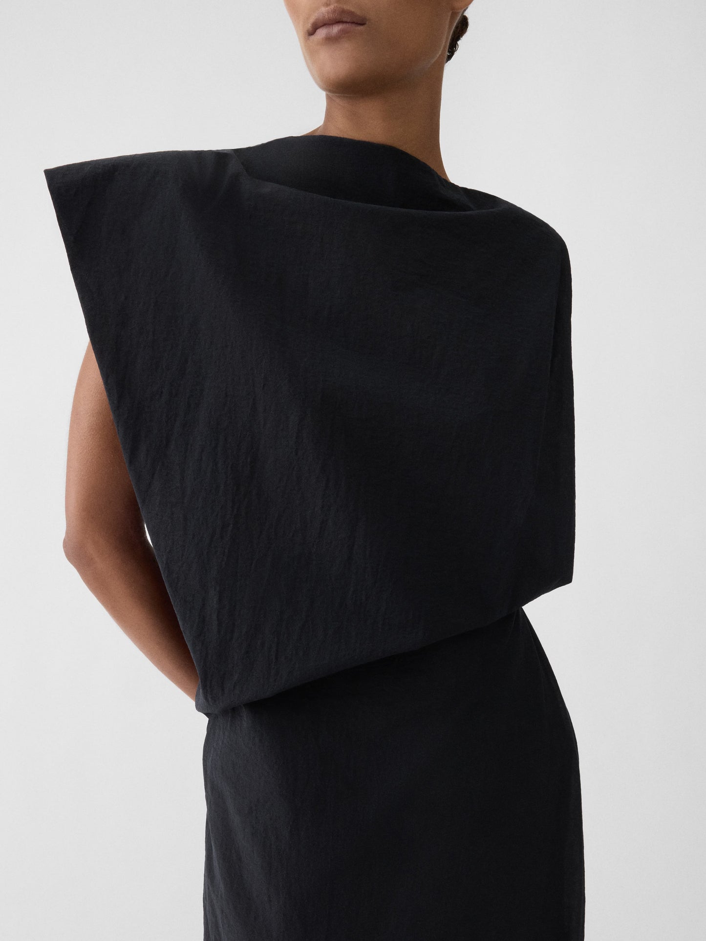 Black one-shoulder dress on a white background JACQUEMUS