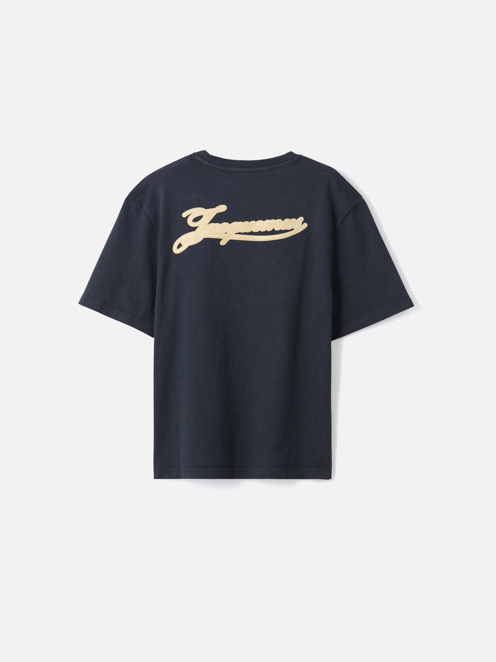 Navy t-shirt with a beige label on a light gray background JACQUEMUS