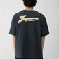 Navy t-shirt with a beige label on a light gray background JACQUEMUS