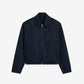 Navy blue jacket on a beige background