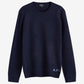 Navy blue sweater with A.P.C. branding on a white background