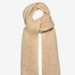 Beige knitted scarf on a light beige background