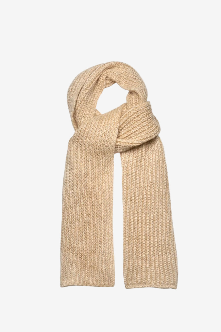 Beige knitted scarf on a light beige background