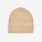 Beige knit beanie on a white background