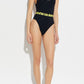 Black swimsuit with yellow logo on a white background