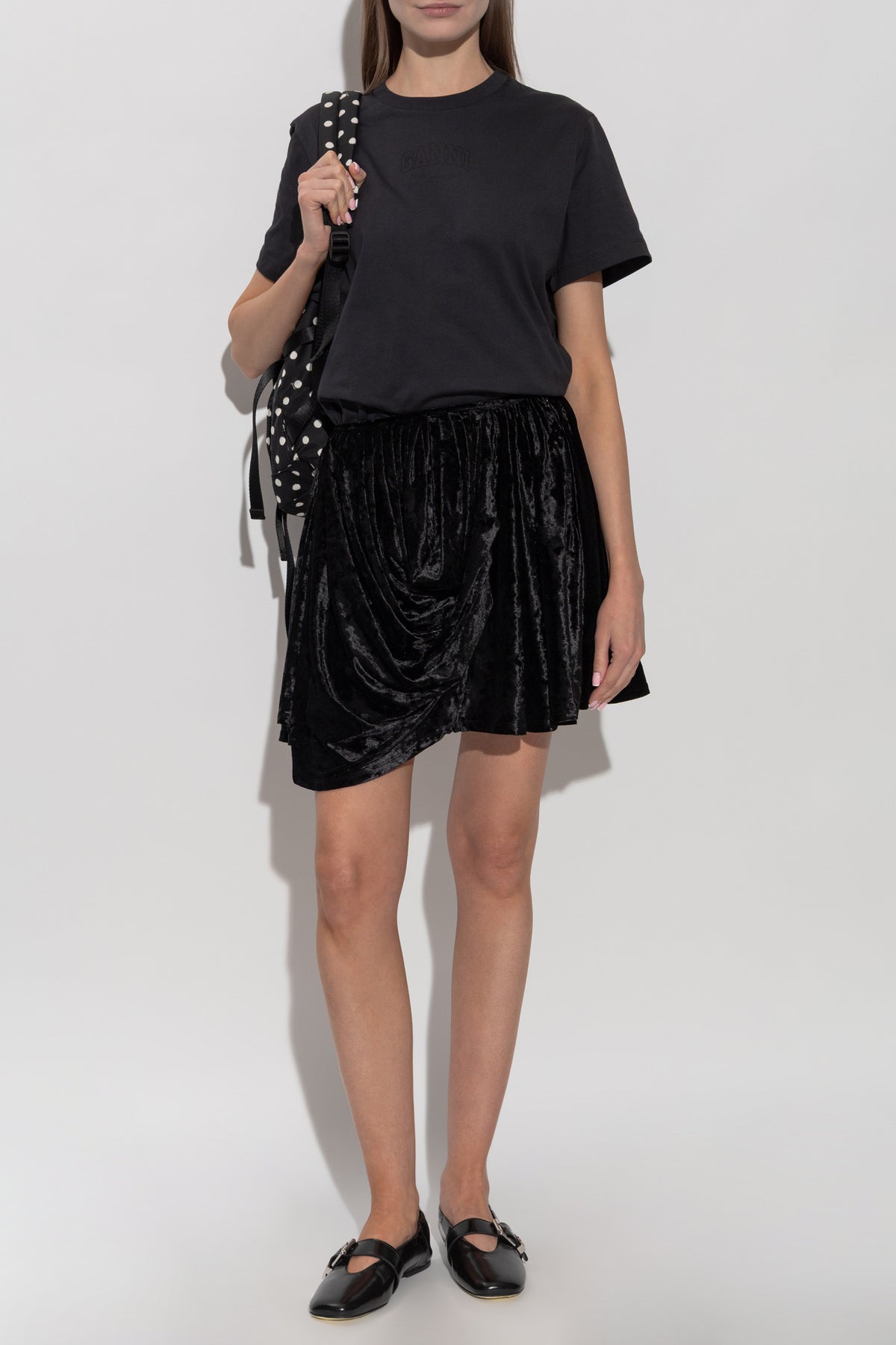 A black short-sleeve crewneck t-shirt by Maruti, shown flat against a plain white background.
