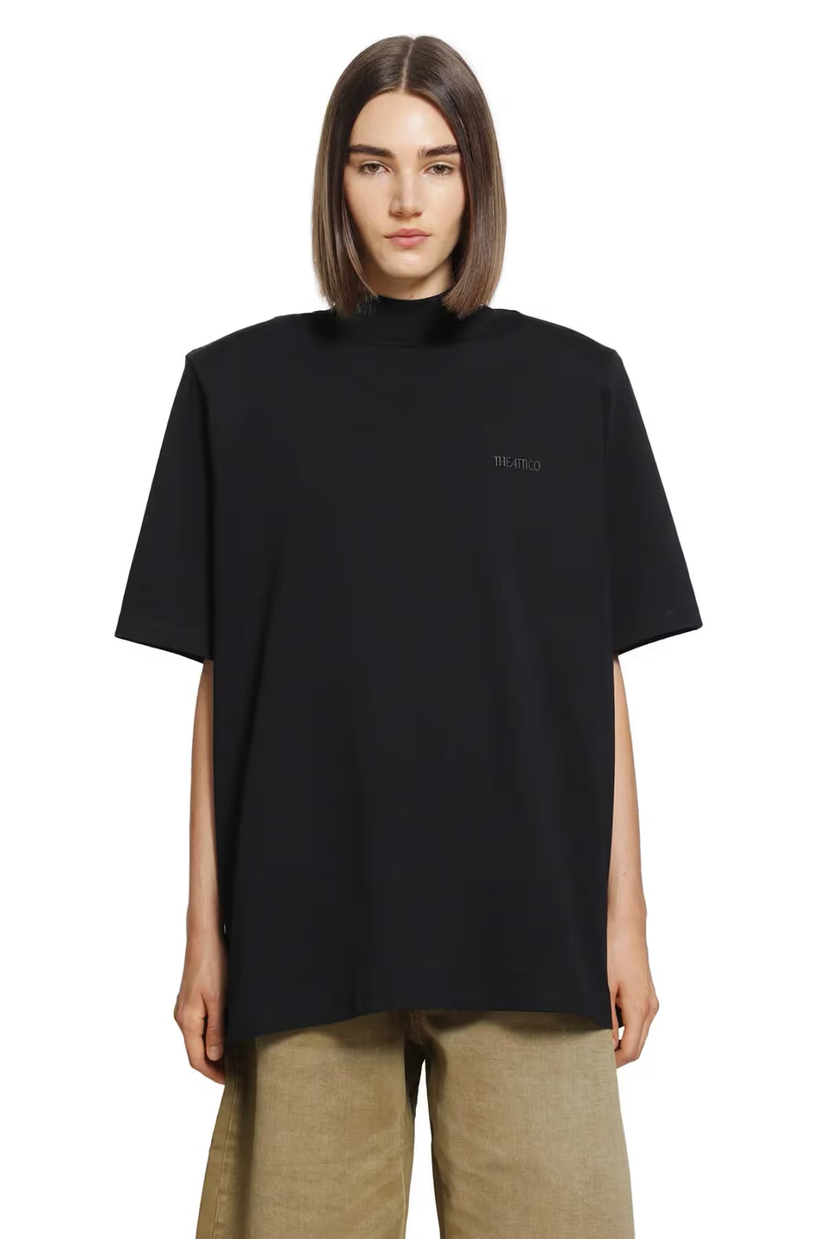 A black short-sleeve t-shirt with a mock neck collar and a small white 'ATTICO' logo on the left chest, displayed against a solid white background.