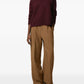 Maroon turtleneck sweater on a beige background