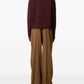 Maroon turtleneck sweater on a beige background