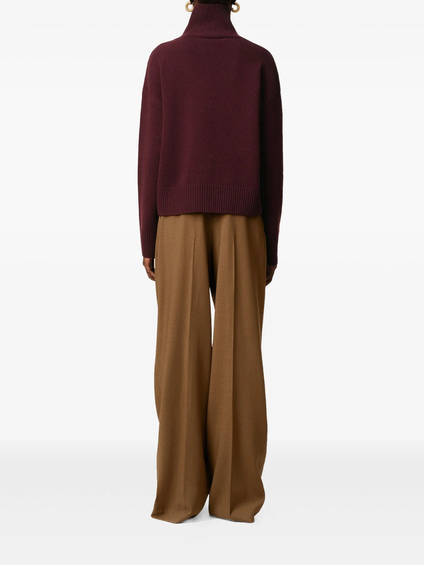 Maroon turtleneck sweater on a beige background
