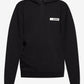Black hoodie with a small logo on the chest against a white background