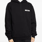 Black hoodie with a small logo on the chest against a white background