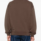 Brown jacket with a visible brand label on a white background